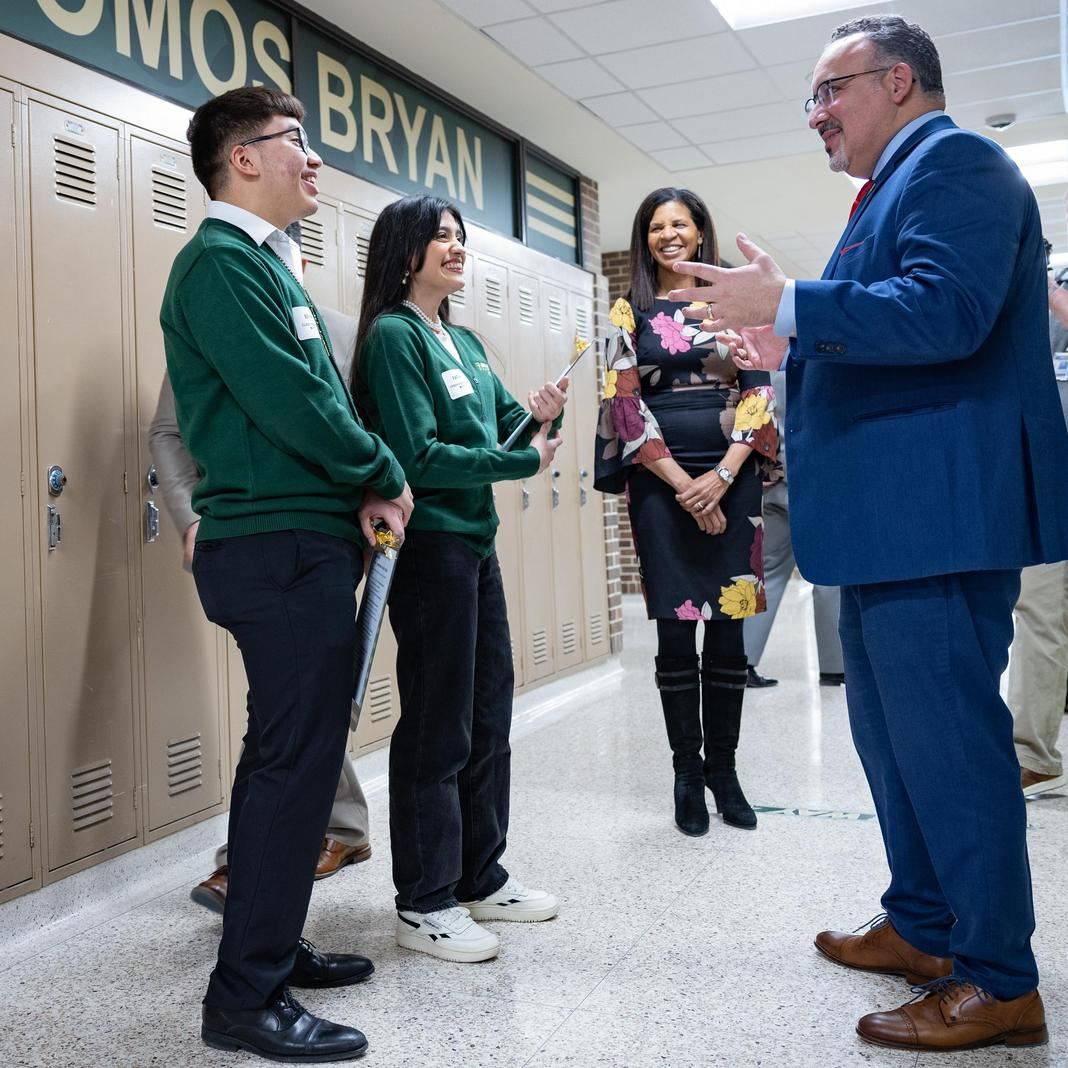 Sec. Cardona speaks with students and Dr. Logan at Bryan High 